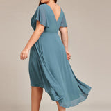 Pleated Wrap Midi Dress with Flutter Sleeves and Asymmetric Hem